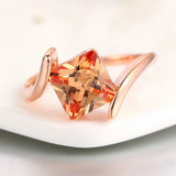 Ring with Orange Precious Stone in Pyramid Cut in Rose Gold