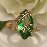 Ring with green gemstone and dragonfly