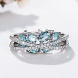 Ring with cross in silver and blue gemstone