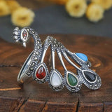 Ethnic silver ring with multicolored gemstones and a beautiful peacock