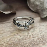 Retro silver ring with flower and swallow