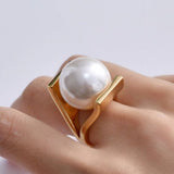 Gold retro ring with pearl inlays