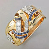 Golden retro ring with blue zirconia