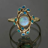 Blue retro ring with crystals and opal