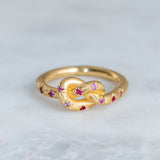 Retro pink ring with golden knot