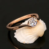 Retro rose gold ring with central stone and round diamonds
