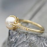 Vintage ring with a golden pearl in the center